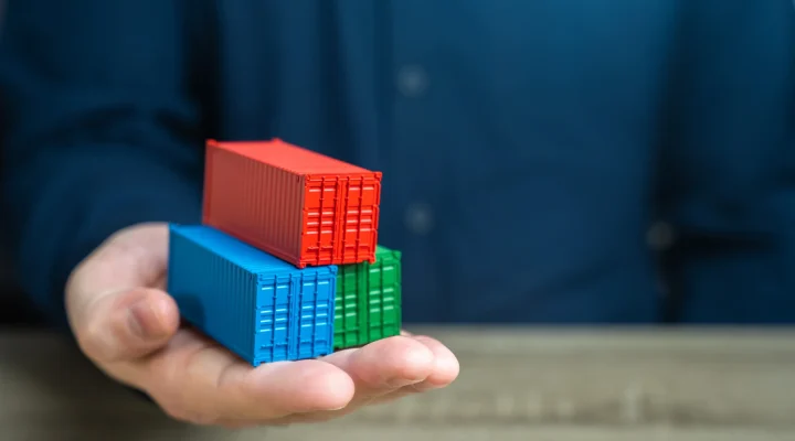 a-man-holds-shipping-containers-in-his-hand-joint-2026-01-08-23-13-35-utc