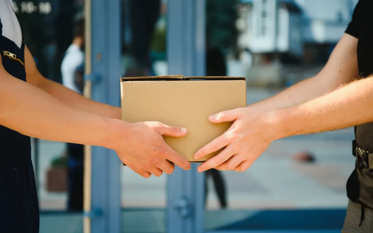 delivery-man-service-with-boxes-in-hands-standing-2026-01-09-06-33-12-utc